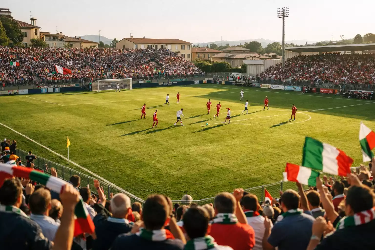 Stadio di Serie B italiano con tribune gremite durante una partita pomeridiana